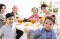 Asian family having dinnerÃÂ at home